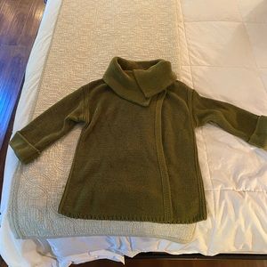 Green knit sweater with cowl neck and top button.